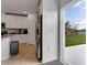 Modern kitchen with stainless steel appliances and backyard view at 2910 Black Birch Dr, Ocoee, FL 34761