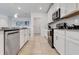 Modern kitchen with white cabinets and stainless steel appliances at 2910 Black Birch Dr, Ocoee, FL 34761