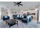 Open concept living area with modern kitchen and sectional sofa at 2910 Black Birch Dr, Ocoee, FL 34761