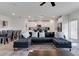 Open floor plan featuring a large sectional sofa and modern kitchen at 2910 Black Birch Dr, Ocoee, FL 34761