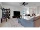 Spacious living room with sectional sofa and built-in shelving at 2910 Black Birch Dr, Ocoee, FL 34761
