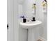 Clean and modern powder room with pedestal sink at 2910 Black Birch Dr, Ocoee, FL 34761