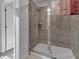 Clean shower with glass enclosure and tiled walls at 2910 Black Birch Dr, Ocoee, FL 34761