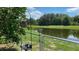 Serene backyard with pond view and bird feeder at 3022 Bransbury Ct, Kissimmee, FL 34747