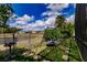 Spacious backyard featuring a pond, a swing set, and a peaceful retreat at 3022 Bransbury Ct, Kissimmee, FL 34747