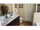 Double vanity bathroom with marble countertop and separate tub and shower at 3022 Bransbury Ct, Kissimmee, FL 34747