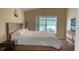 Main bedroom with large window and TV at 3022 Bransbury Ct, Kissimmee, FL 34747