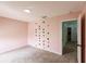 Bedroom featuring a climbing wall with colorful holds and neutral carpet at 3022 Bransbury Ct, Kissimmee, FL 34747