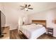 A light-filled bedroom featuring a modern bed, ceiling fan, and views into the home at 3022 Bransbury Ct, Kissimmee, FL 34747