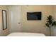 Bedroom with a queen bed, TV and plant at 3022 Bransbury Ct, Kissimmee, FL 34747