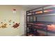 Bedroom with a bunk bed and Lion King decor at 3022 Bransbury Ct, Kissimmee, FL 34747