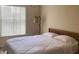 Bedroom with a queen bed and large window at 3022 Bransbury Ct, Kissimmee, FL 34747