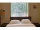 Bedroom with a full-size bed and window at 3022 Bransbury Ct, Kissimmee, FL 34747