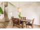 Dining room with wood furniture and natural lighting. Stairs leading up to the next level of the home at 3022 Bransbury Ct, Kissimmee, FL 34747