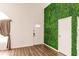 Bright entryway with a statement green wall, offering a unique and modern touch to the home at 3022 Bransbury Ct, Kissimmee, FL 34747