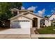 Inviting single-Gathering home with a two-car garage, manicured lawn, and a welcoming front entrance at 3022 Bransbury Ct, Kissimmee, FL 34747