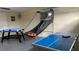 Basement game room with ping pong, air hockey, and basketball game at 3022 Bransbury Ct, Kissimmee, FL 34747