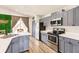 Stylish kitchen with a large sink, stainless steel appliances, and an eye-catching green wall at 3022 Bransbury Ct, Kissimmee, FL 34747