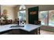Modern kitchen with breakfast bar and pool view at 3022 Bransbury Ct, Kissimmee, FL 34747