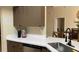 Kitchen with white countertops and dark cabinets at 3022 Bransbury Ct, Kissimmee, FL 34747