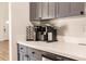 Close-up of a well-organized kitchen featuring light countertops and modern appliances at 3022 Bransbury Ct, Kissimmee, FL 34747