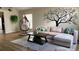Cozy living room with sectional sofa, coffee table, and hanging chair at 3022 Bransbury Ct, Kissimmee, FL 34747