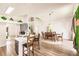 Bright, open floor plan with a modern kitchen, dining area, and staircase, perfect for entertaining at 3022 Bransbury Ct, Kissimmee, FL 34747