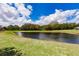 Scenic backyard pond perfect for relaxation and connecting with nature at 3022 Bransbury Ct, Kissimmee, FL 34747