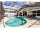 Covered pool area with chairs, slide, and colorful fish themed in-pool decorations at 3022 Bransbury Ct, Kissimmee, FL 34747