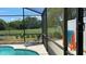 Screened pool area with lounge chairs, and a game at 3022 Bransbury Ct, Kissimmee, FL 34747