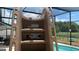 Backyard pool with a large brown slide at 3022 Bransbury Ct, Kissimmee, FL 34747