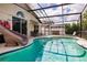Relaxing screened-in pool area with a fun water slide, perfect for enjoying the outdoors in privacy at 3022 Bransbury Ct, Kissimmee, FL 34747