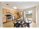 Kitchen with stainless steel appliances and glass dining table at 3944 Janie Ct, Orlando, FL 32822