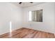 Well-lit bedroom with wood-like floor and window at 4392 S Lake Orlando Pkwy # 4, Orlando, FL 32808