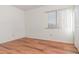 Simple bedroom featuring wood-look floors and a window with blinds at 4392 S Lake Orlando Pkwy # 4, Orlando, FL 32808