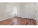 Bedroom with wood-look floors and double door closet at 4392 S Lake Orlando Pkwy # 4, Orlando, FL 32808
