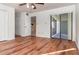 Bedroom with wood-look floors, access to patio, and ample closet space at 4392 S Lake Orlando Pkwy # 4, Orlando, FL 32808