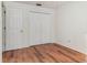 Bedroom with wood-look floors and double door closet at 4392 S Lake Orlando Pkwy # 4, Orlando, FL 32808