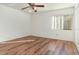 Bright bedroom with wood-look flooring and ceiling fan at 4392 S Lake Orlando Pkwy # 4, Orlando, FL 32808