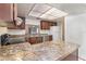 Kitchen with dark wood cabinets and granite counters at 4392 S Lake Orlando Pkwy # 4, Orlando, FL 32808