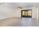 Living room with tile floors and sliding glass doors at 4392 S Lake Orlando Pkwy # 4, Orlando, FL 32808