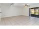 Living room with tile floors and sliding glass doors at 4392 S Lake Orlando Pkwy # 4, Orlando, FL 32808