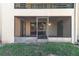 Enclosed patio with sliding glass doors and access to the yard at 4392 S Lake Orlando Pkwy # 4, Orlando, FL 32808