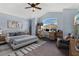 This staged bedroom has a vaulted ceiling, carpet and a large window at 5810 Penney Ln, The Villages, FL 32163