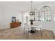 Elegant dining room featuring modern lighting, decor, and tiled flooring at 5810 Penney Ln, The Villages, FL 32163