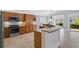 Well-equipped kitchen with stainless steel appliances and granite countertops at 5810 Penney Ln, The Villages, FL 32163