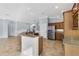 Kitchen with an island, stainless steel appliances, and wood cabinets at 5810 Penney Ln, The Villages, FL 32163