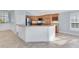 Corner kitchen with a breakfast bar and wooden cabinets at 5810 Penney Ln, The Villages, FL 32163