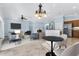 Open living area with a kitchen and comfortable seating arrangements at 5810 Penney Ln, The Villages, FL 32163