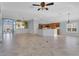 Spacious open-plan living area featuring tile floors and natural light at 5810 Penney Ln, The Villages, FL 32163